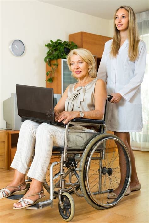 social worker and invalid with laptop stock image image of paraplegic guardianship 68715917