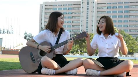 Cute Cheerful Asian Thai High Schoolgirls Student Couple