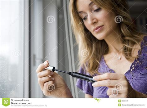 Woman applying makeup stock image. Image of care, cosmetic ...