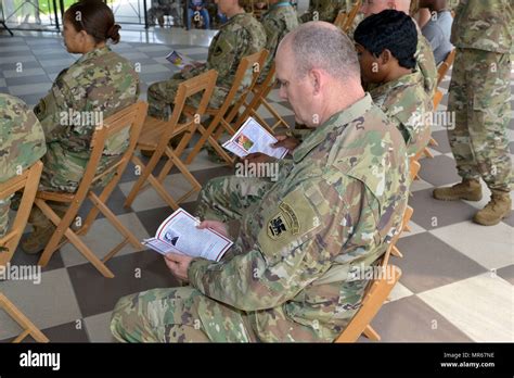 Us Army Soldiers Assigned To The Hhc Setaf Read A Brochure At The