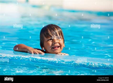 Portrait Of Happy Boy In Swimming Pool Stock Photo Alamy