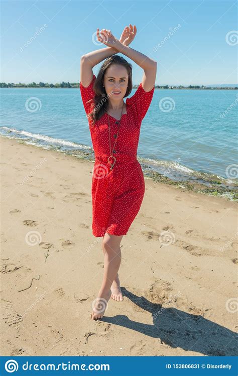 Brunette In Red On A Beach Stock Image Image Of Lovely 153806831