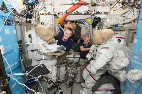 Astronauts Taking Spacewalk To Install New Space Station Docking Port