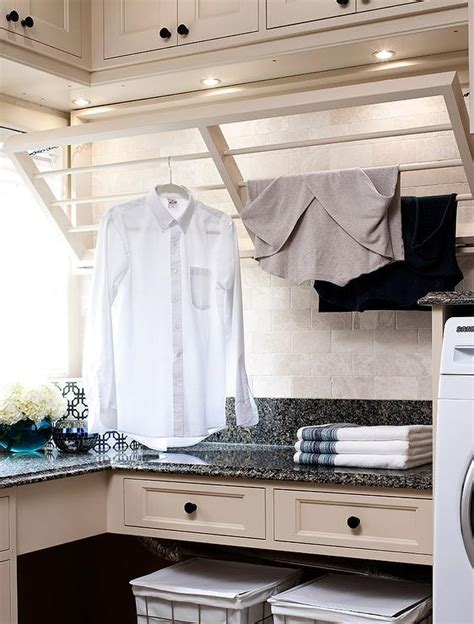 The kv pull down cookbook rack keeps recipes where you really need them, right above the countertop in your kitchen work space. Tan Laundry Room with Drop Down Drying Rack - Transitional ...