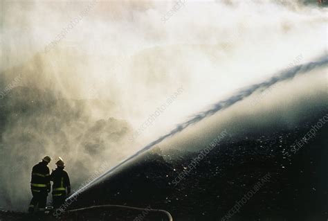 Firefighter Extinguishing A Ground Fire Stock Image T6640087 Science Photo Library