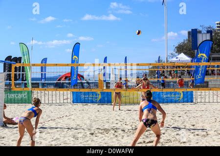 Womans Team Play Beach Volleyball At Surfers Paradise On The First Day Of A Summer Morning Stock