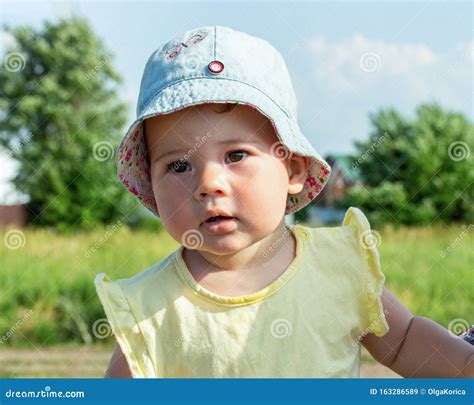 Portrait Of A Child In Summer Clothes And A Panama Little Caucasian