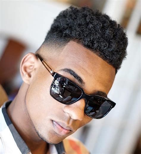 This hairstyle is usually made with twists at the top, but having natural curls with the taper fade is what gives this little boy haircut for black hair a new and fresh look that is much easier to create. The Best Haircuts for Black Boys In 2017