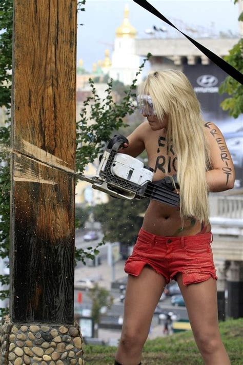 Femen Protestor Chainsaws Cross In Support Of Pussy Riot