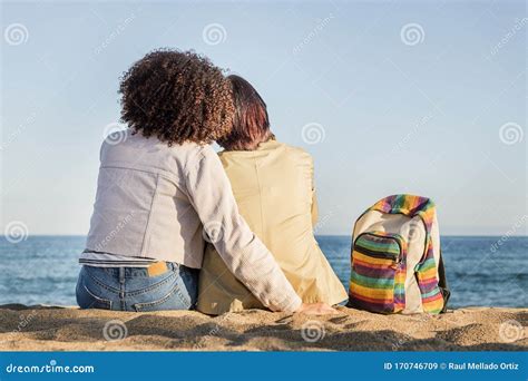 Lesbian Couple Embracing In Front Of The Sea Stock Image Image Of