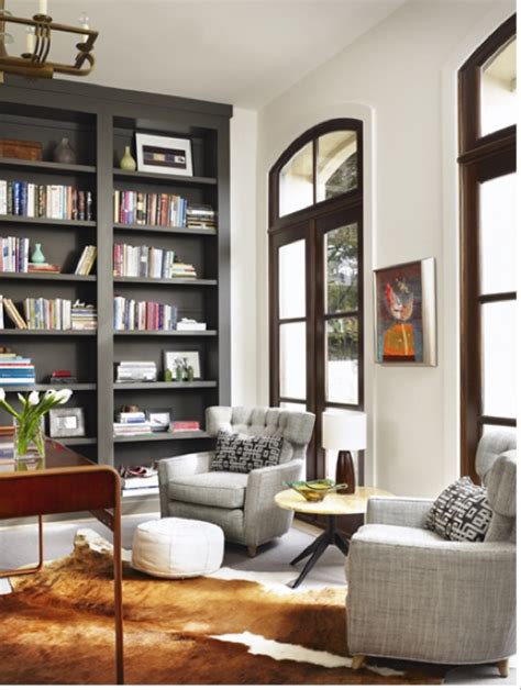 Dark Grey Bookshelves Stand Out Like Furniture Against White Walls
