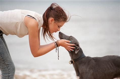 Teenage Girl Kissing Her Pet Dog By Stocksy Contributor Lee Avison