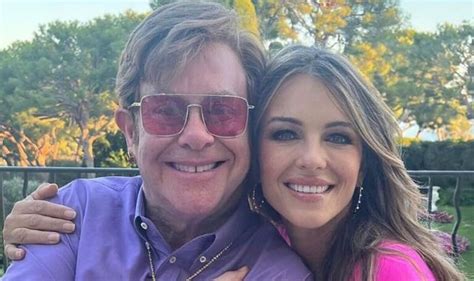 Liz Hurley Wows In Plunging Pink Outfit As She Grins With Elton John On