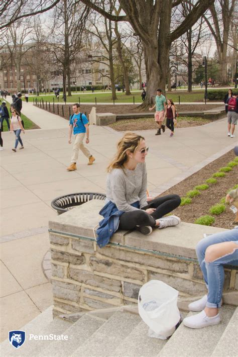 Penn State Students Enjoying The Warm Day Outside Old Main