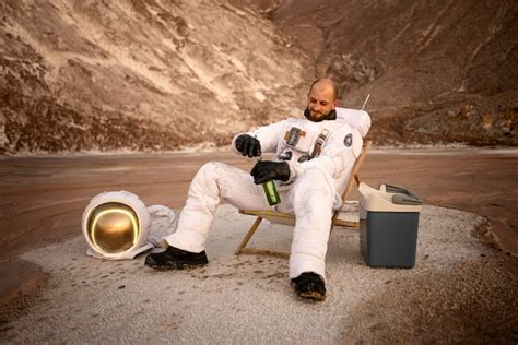 Free Photo Male Astronaut Drinking A Beer During A Space Mission On