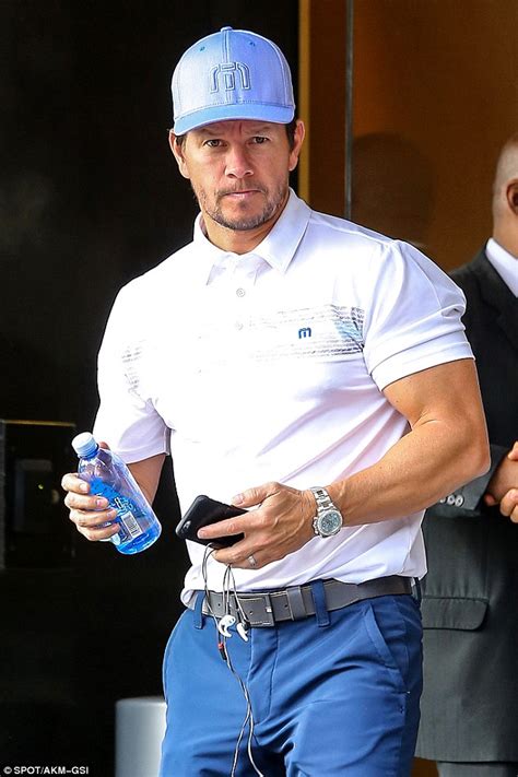 Mark Wahlberg Showcases His Biceps As He Steps Out In Polo Shirt