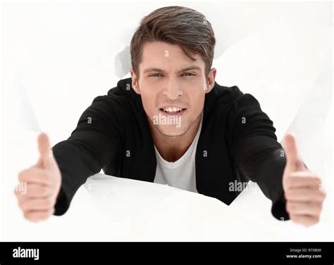 Man Breaking Through Paper Wall And Showing Thumbs Up Stock Photo Alamy