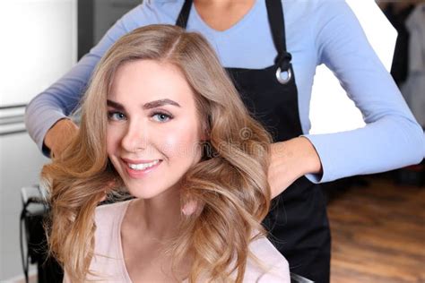 Professional Hairdresser Working With Client In Beauty Salon Stock