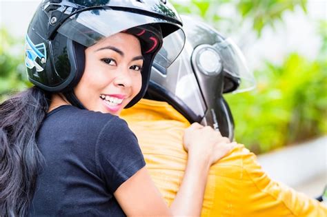 Premium Photo Asian Couple Riding Motorcycle Wife Is Sitting Behind Her Husband
