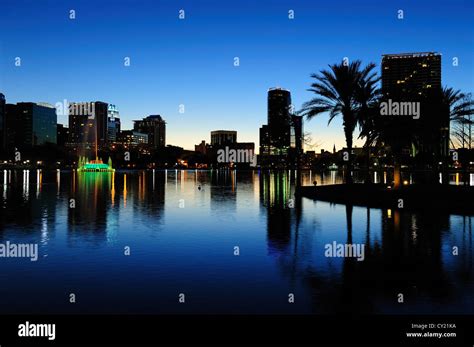 Orlando Downtown Skyline Panorama Silhouette Over Lake Eola At Dusk