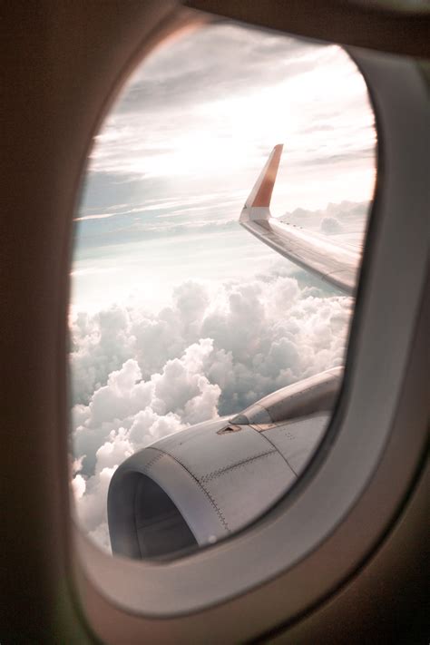 clear plane window photo free transportation image on unsplash airplane window view travel