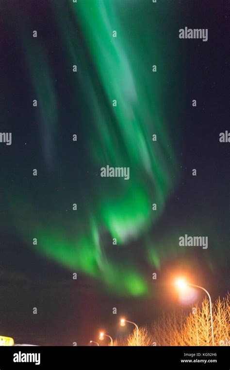 Northern Lights Aurora Borealis Above Street In Iceland Stock Photo Alamy