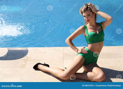 Beautiful Sensual Girl With Blond Hair Wears Luxurious Green Swimsuit Stock Photo Image Of