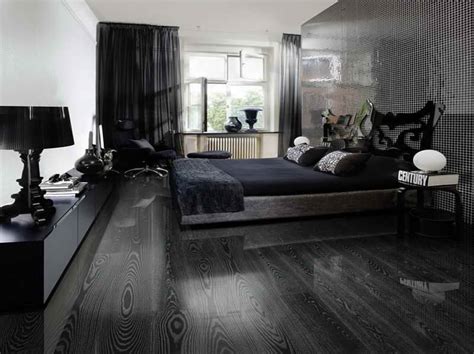 This beautiful bedroom with the cool bed and grey exposed brick walls makes for a fresh bedroom the wooden flooring is also a real nice feature of the room, supporting a floating bed in the centre. Black Hardwood Flooring As An Excellent Combination Of ...