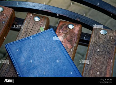 Notebook On Bench In Park Business Concept Stock Photo Alamy