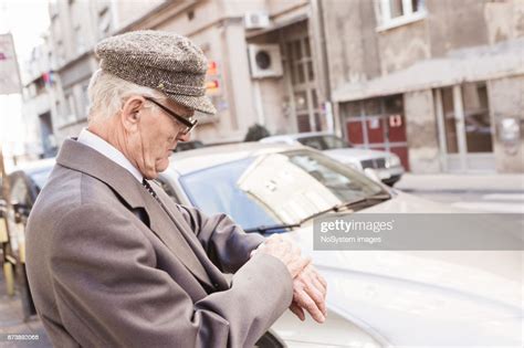Social Seniors Old Man Waiting Taxi On Street High Res Stock Photo