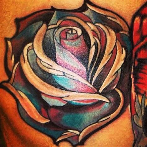 A tribal rose tattoo design is the linear and long design and it will look perfect on ankle or arm. Artistic colorful red blue rose flower tattoo ...