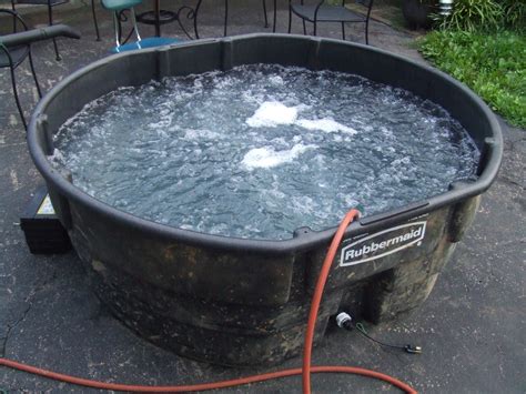 The galvanized metal tubs look good inside or out, and with a starting price of $50, they're pretty darn. Stock Tank Hot Tub | hillbilly hot tub made from a 300 ...