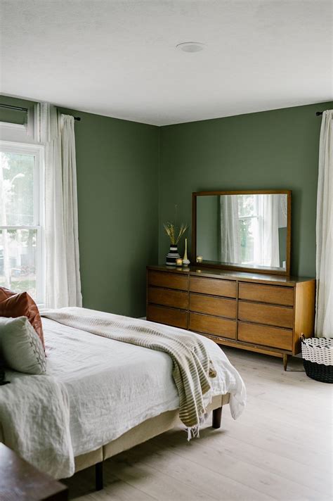 our sage green guest bedroom with midcentury furniture miranda schroeder green and white