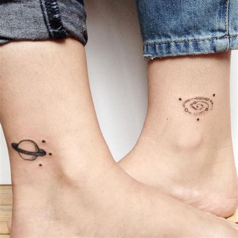 Matching Saturn And Spiral Galaxy Tattoos On The Ankles Matching Best