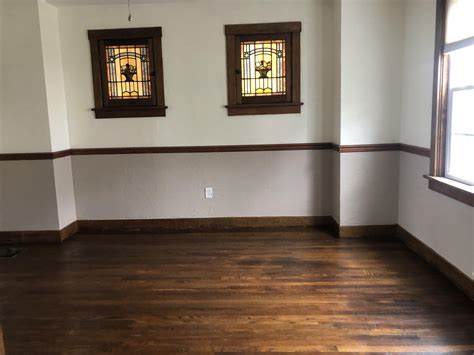 Dark wood trim is everywhere. Keeping the natural wood trim. (Chair rail was added by ...