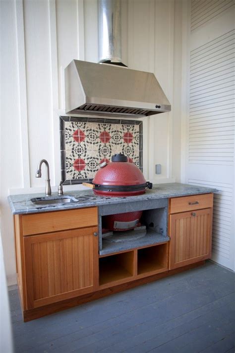 304 stainless steel cabinets with a contemporary frameless design. Spanish Cedar cabinet design with bead board design and slab front drawers. | Outdoor kitchen ...