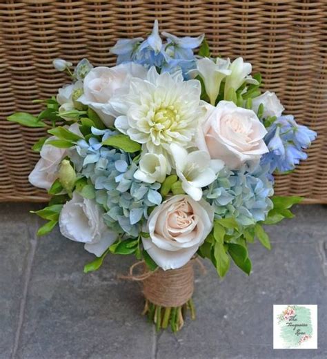 Layer in the longer clematis stems, both blue and white. Pretty blue and white 'just picked' bouquet featuring ...