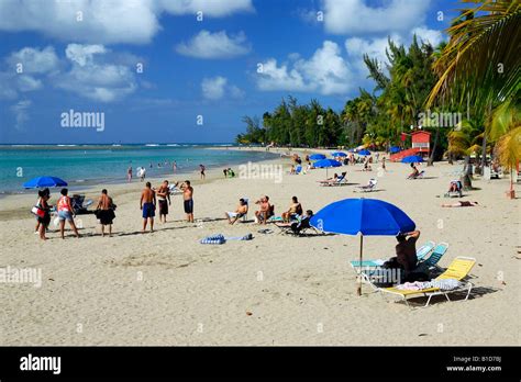 People Enjoy A Beautiful Afternoon At The Luquillo Beach Balneario Luquillo And Mar Sin Barreras