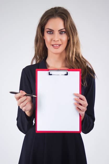 Business Woman Holding A Clipboard With Pen And Copy Space Isol Photo