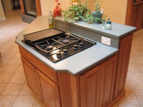 The cooktop is part of this relatively small kitchen island. Different Kitchen Island Designs | hac0.com