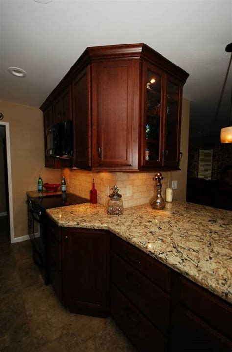 Omega, renner door style, maple pure white. StarMark maple chestnut cabinets with Cambria Bradshaw ...