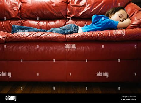 Asian Girl Sleeping On Sofa Stock Photo Alamy
