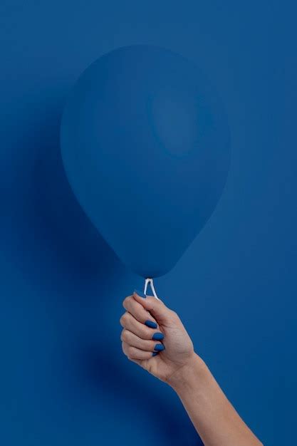 Free Photo Female Hand Holding Balloon