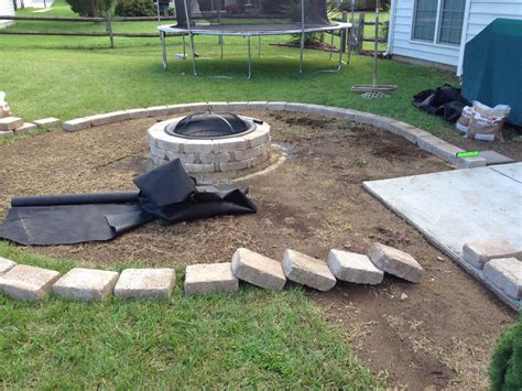 Laying the rumble stone border for fire pit | Fire pit, Fire pit