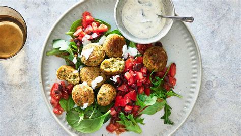 Learn how to make falafel with this easy baked falafel recipe! Baked Falafel with Tomato-Olive Salad | Stop and Shop