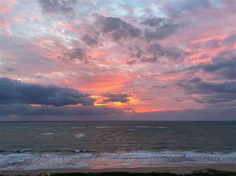 A Vibrant Sunrise Over The Atlantic Ocean Stock Photo Image Of