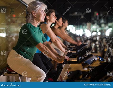 Mature Woman Taking Cycling Class At Gym Stock Image Image Of Mature Machine