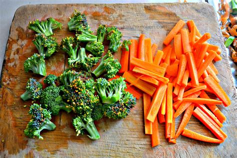 Preparing Fresh Carrots And Broccoli For Steamingthe Smaller You Cut