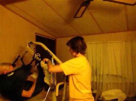 • using the steering handle, move the lift away from the bed. Hoyer lift - transferring from wheelchair to bed part 2 of ...