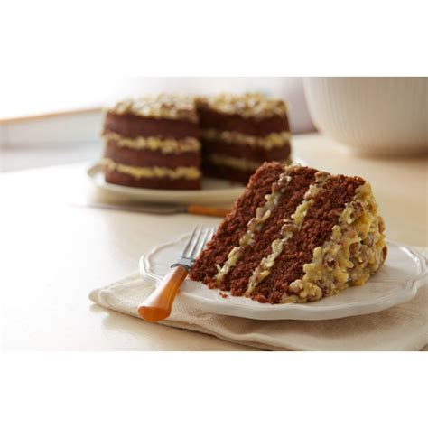 Homemade german chocolate cake, with two layers of scratch made cake, a sticky coconut pecan topping, and fudge frosting is everyone's favorite cake! german chocolate cake from scratch